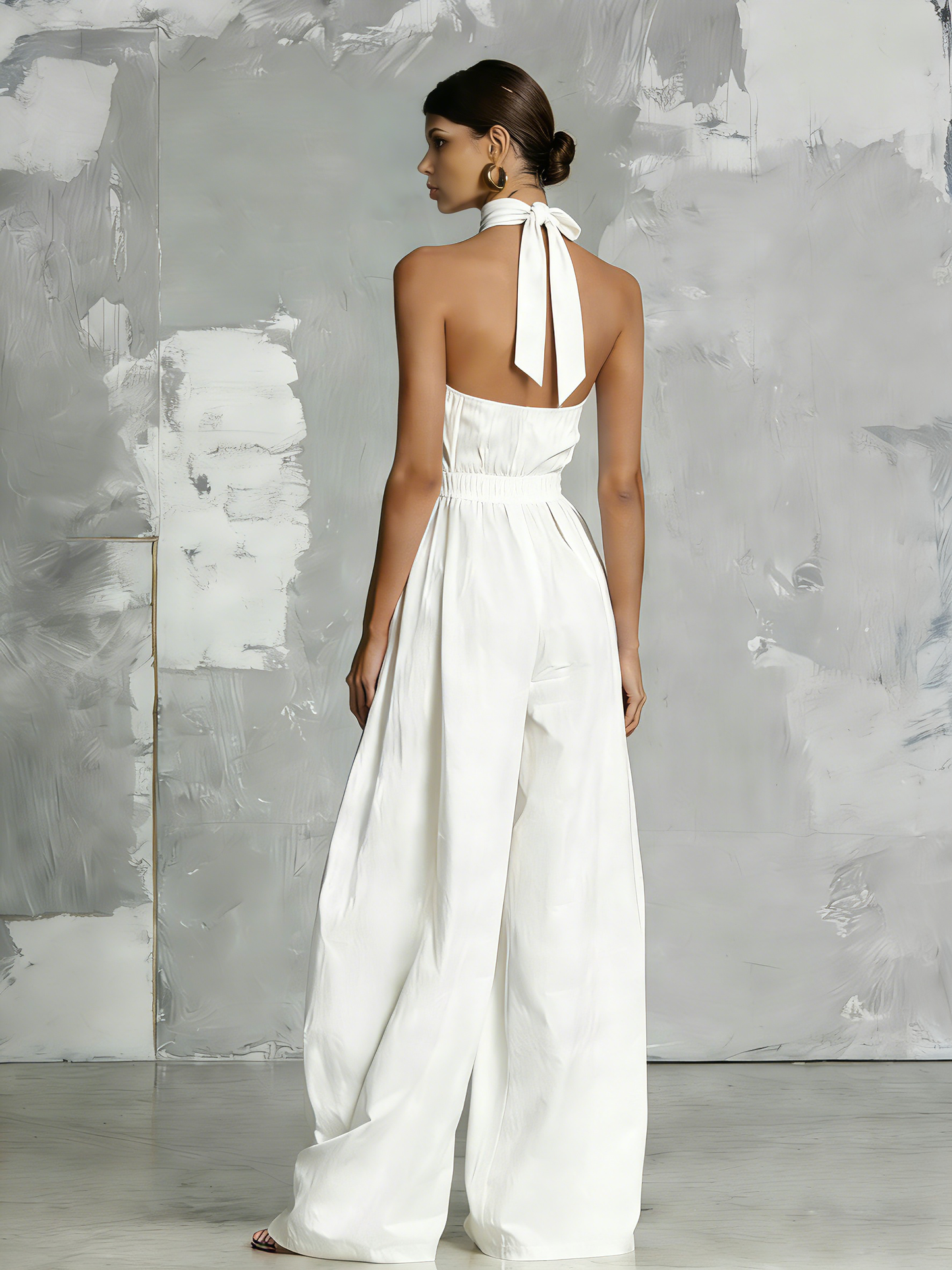 Elegant white woven jumpsuit, sleeveless, with halter neck