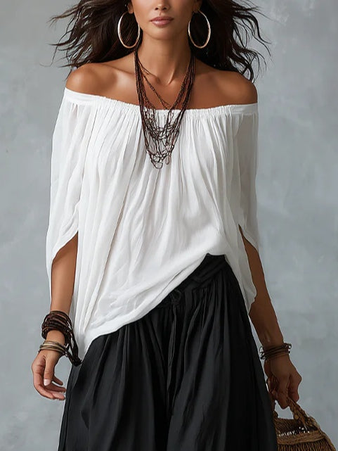 Conjunto de top blanco de hombros descubiertos y pantalón ancho